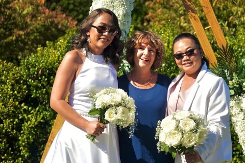 The happy couple posing with Debbie.