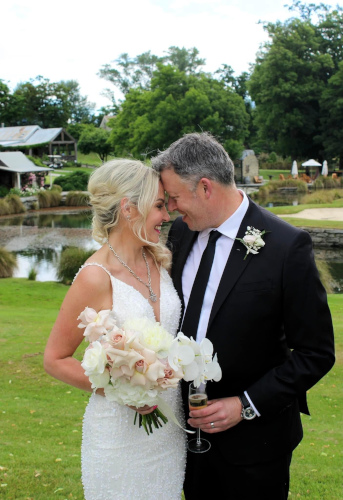 Bride and groom after the ceremony at beautiful out door setting.